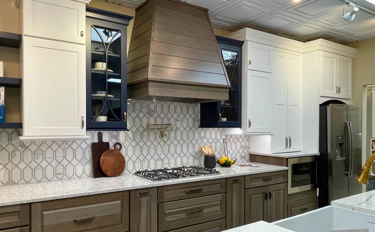 black, white, and wooden cabinets in a kitchen display at Kiba Studios in Mentor, OH