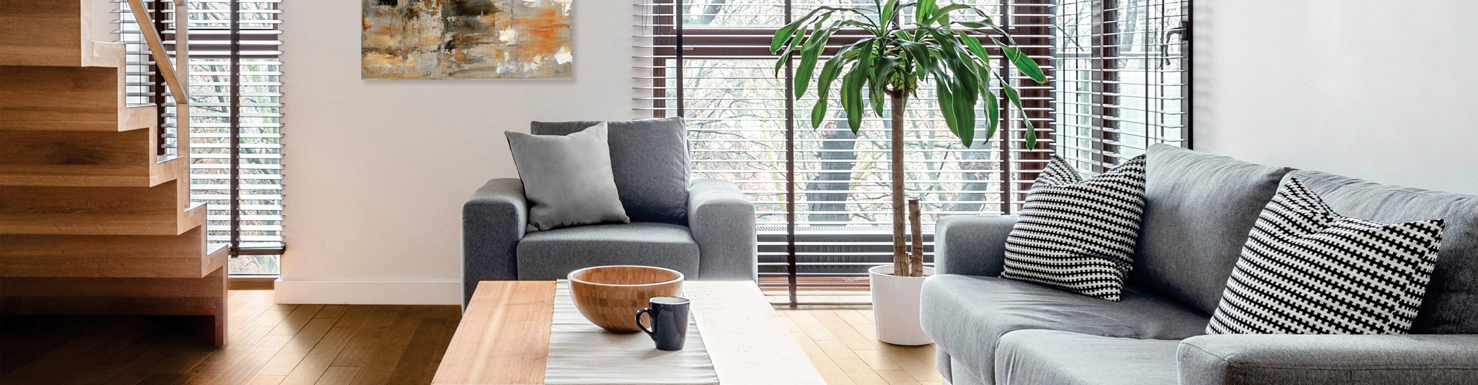 window treatments custom wood blinds in living room with grey furniture and wood floors